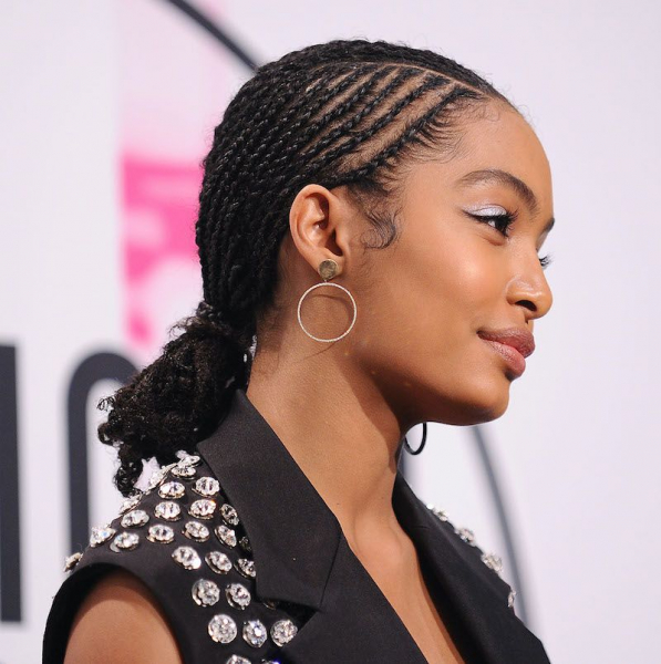 Easy On-the-Go Hairstyles for Naturally Curly Hair Low Bun with Braids Yara Shahidi